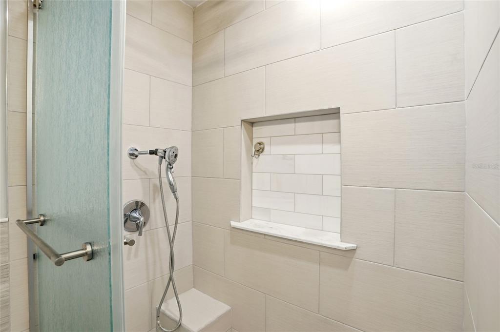 3345 Furlong Way Gotha, FL 34734 - Photo 29 of 34 a bathroom with a glass shower door