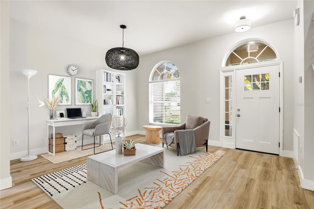 3345 Furlong Way Gotha, FL 34734 - Photo 3 of 34 a living room with furniture a window and a table