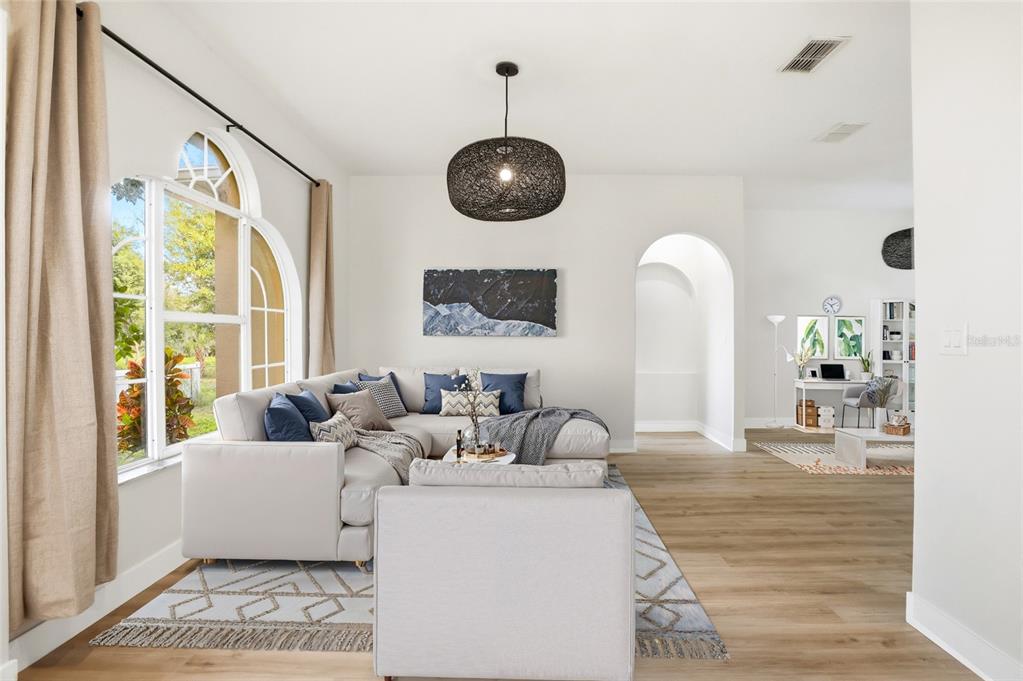 3345 Furlong Way Gotha, FL 34734 - Photo 5 of 34 a living room with furniture and a large window