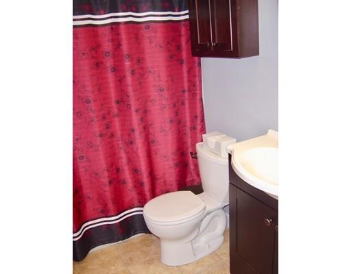 59 H Foote Road Charlton, MA 01507 - Photo 30 of 42 a bathroom with a toilet and a shower curtain