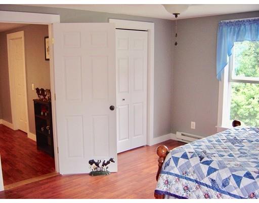 59 H Foote Road Charlton, MA 01507 - Photo 36 of 42 a bedroom with a bed and a window