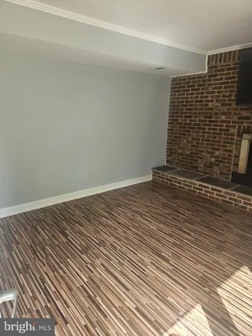 a view of wooden floor with staircase