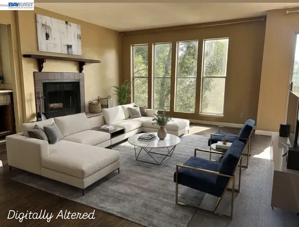 a living room with fireplace furniture and a wooden floor