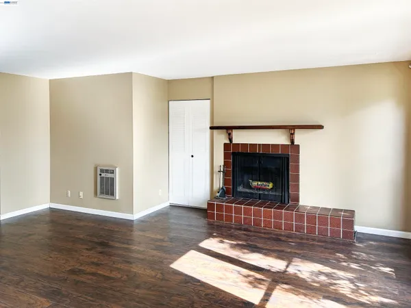 a kitchen with a stove top oven and refrigerator