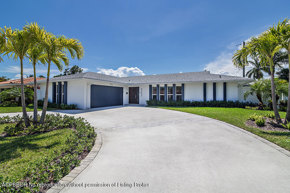 2285 Palm Road West Palm Beach, FL 33406 - Photo 2 of 27 a house with palm tree in front of it