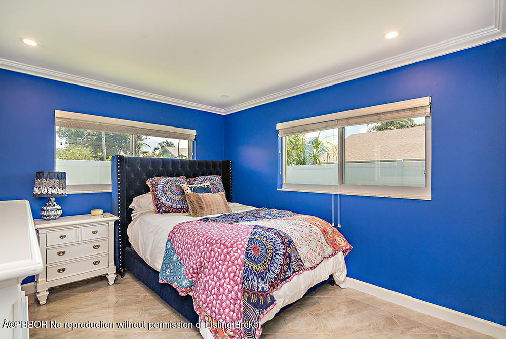 2285 Palm Road West Palm Beach, FL 33406 - Photo 14 of 27 a bedroom with a bed and a window