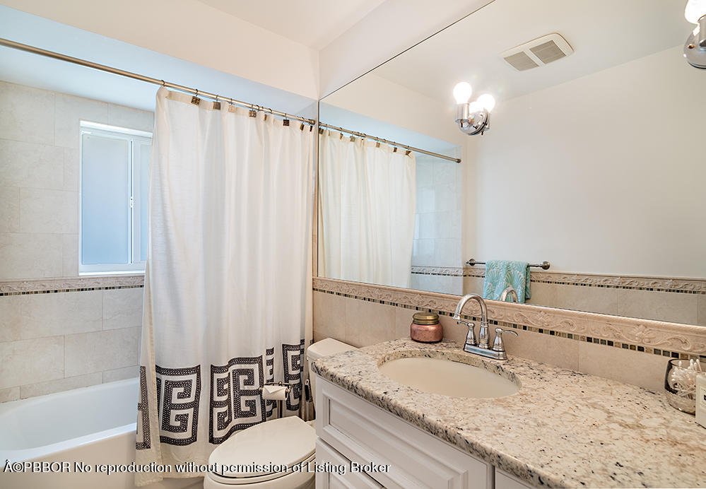 2285 Palm Road West Palm Beach, FL 33406 - Photo 15 of 27 a bathroom with a granite countertop sink and a mirror