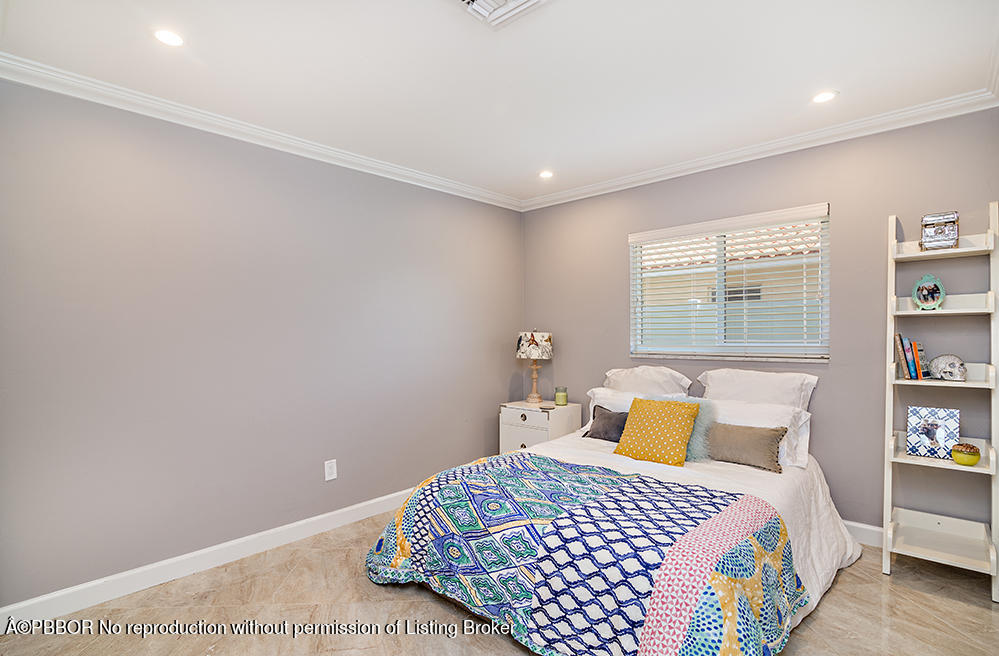 2285 Palm Road West Palm Beach, FL 33406 - Photo 16 of 27 a bedroom with a bed and window