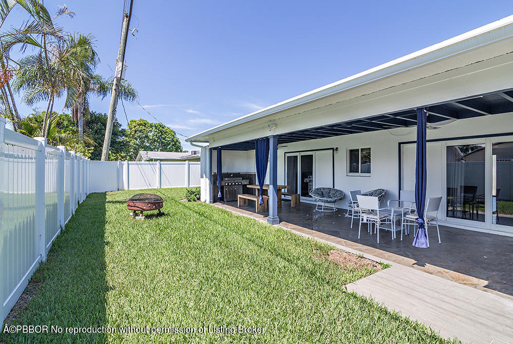 2285 Palm Road West Palm Beach, FL 33406 - Photo 18 of 27 a view of a backyard with a patio and plants