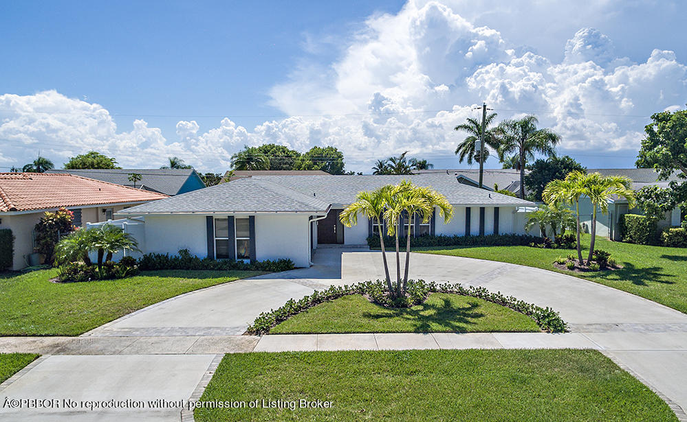 2285 Palm Road West Palm Beach, FL 33406 - Photo 21 of 27 a front view of a house with garden