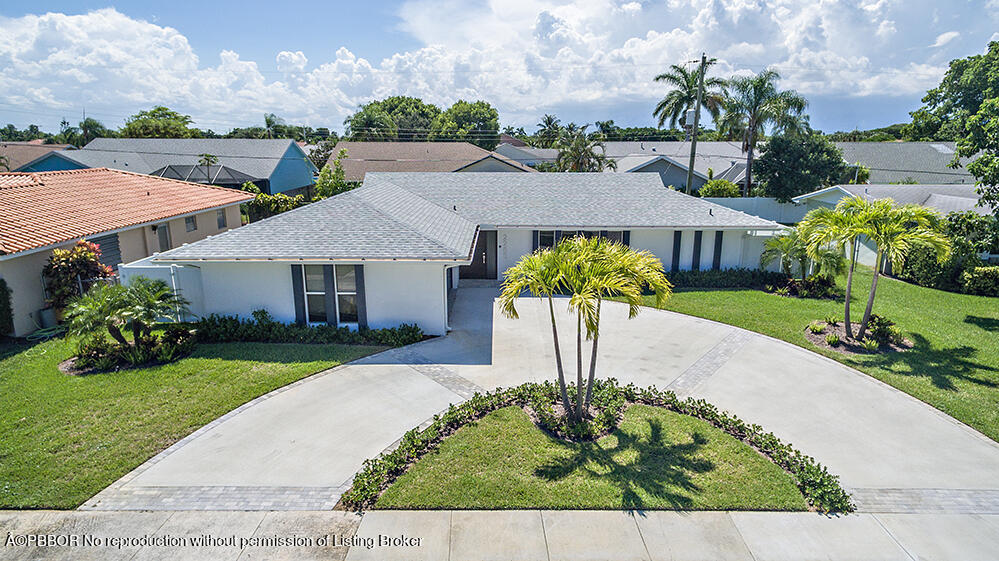 2285 Palm Road West Palm Beach, FL 33406 - Photo 22 of 27 a front view of a house with a garden