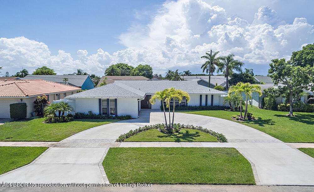 2285 Palm Road West Palm Beach, FL 33406 - Photo 23 of 27 a front view of a house with garden