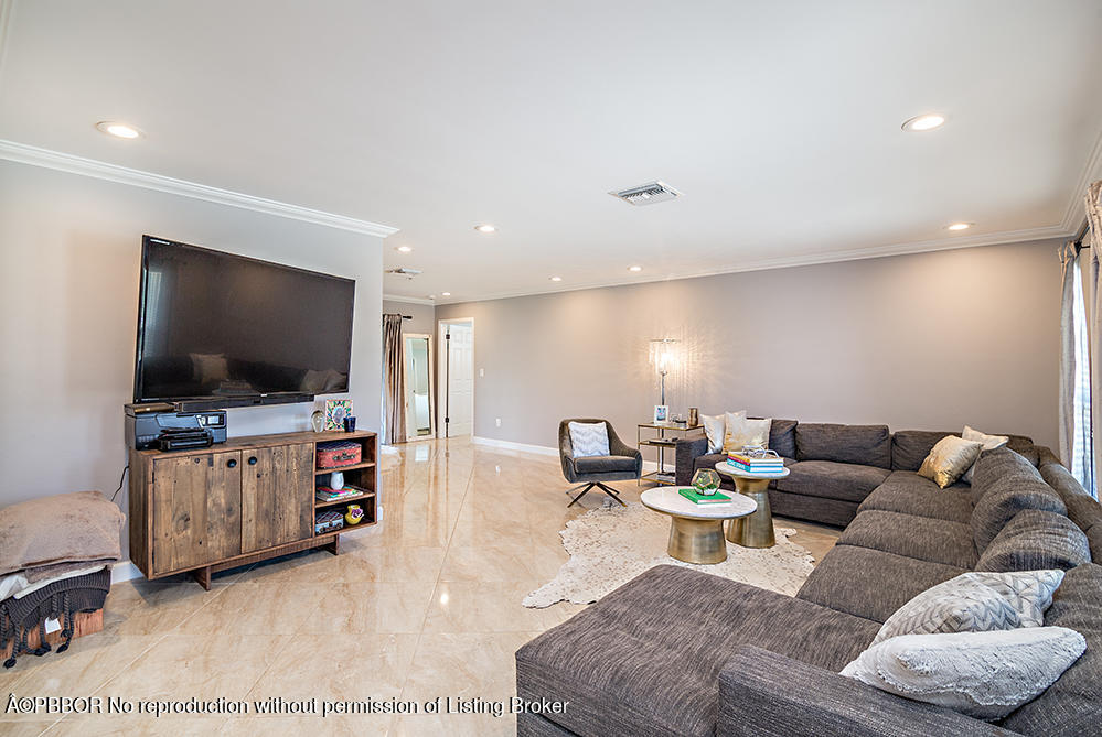 2285 Palm Road West Palm Beach, FL 33406 - Photo 4 of 27 a living room with furniture and a flat screen tv