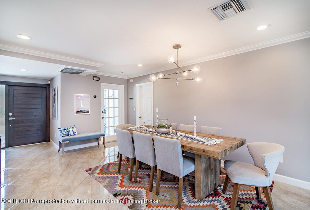 2285 Palm Road West Palm Beach, FL 33406 - Photo 6 of 27 a view of a dining room with furniture and wooden floor