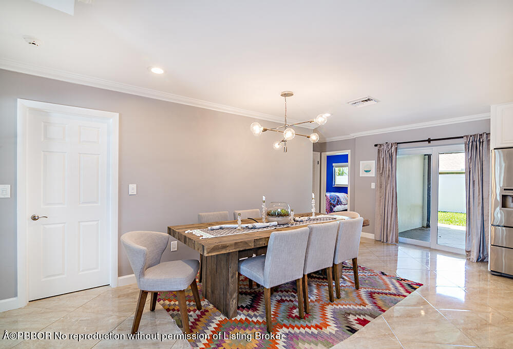 2285 Palm Road West Palm Beach, FL 33406 - Photo 7 of 27 a view of a dining room with furniture and wooden floor