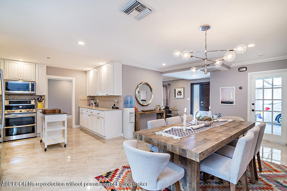 2285 Palm Road West Palm Beach, FL 33406 - Photo 8 of 27 a view of a dining room with furniture