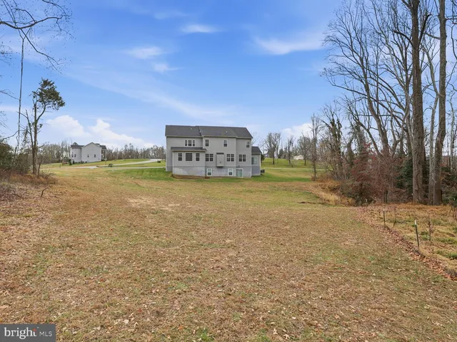 a view of a large body of water with a building in the background