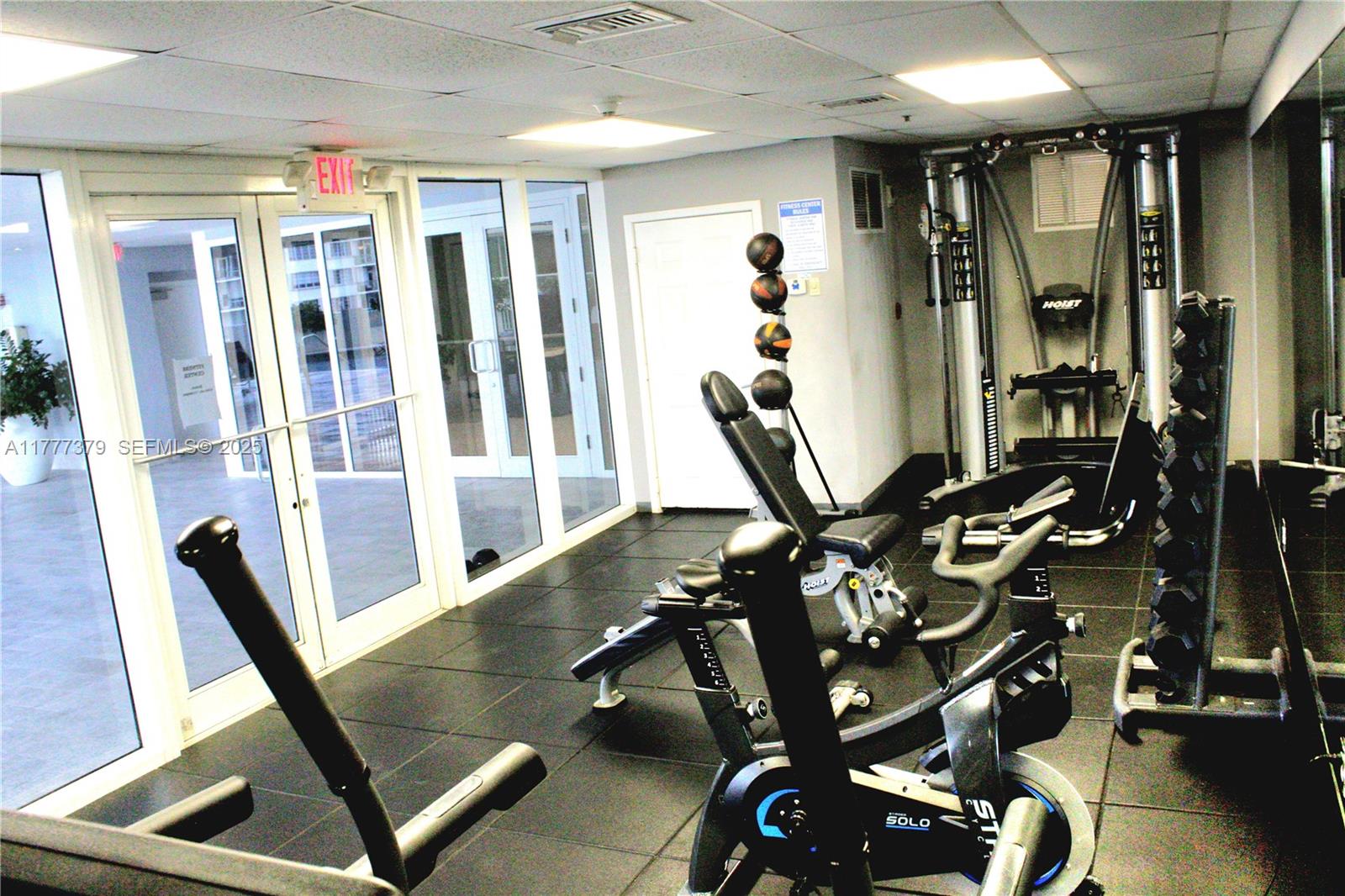 170 Southeast 14th Street, Unit 2705 Miami, FL 33131 - Photo 11 of 41 a view of a room with gym equipment
