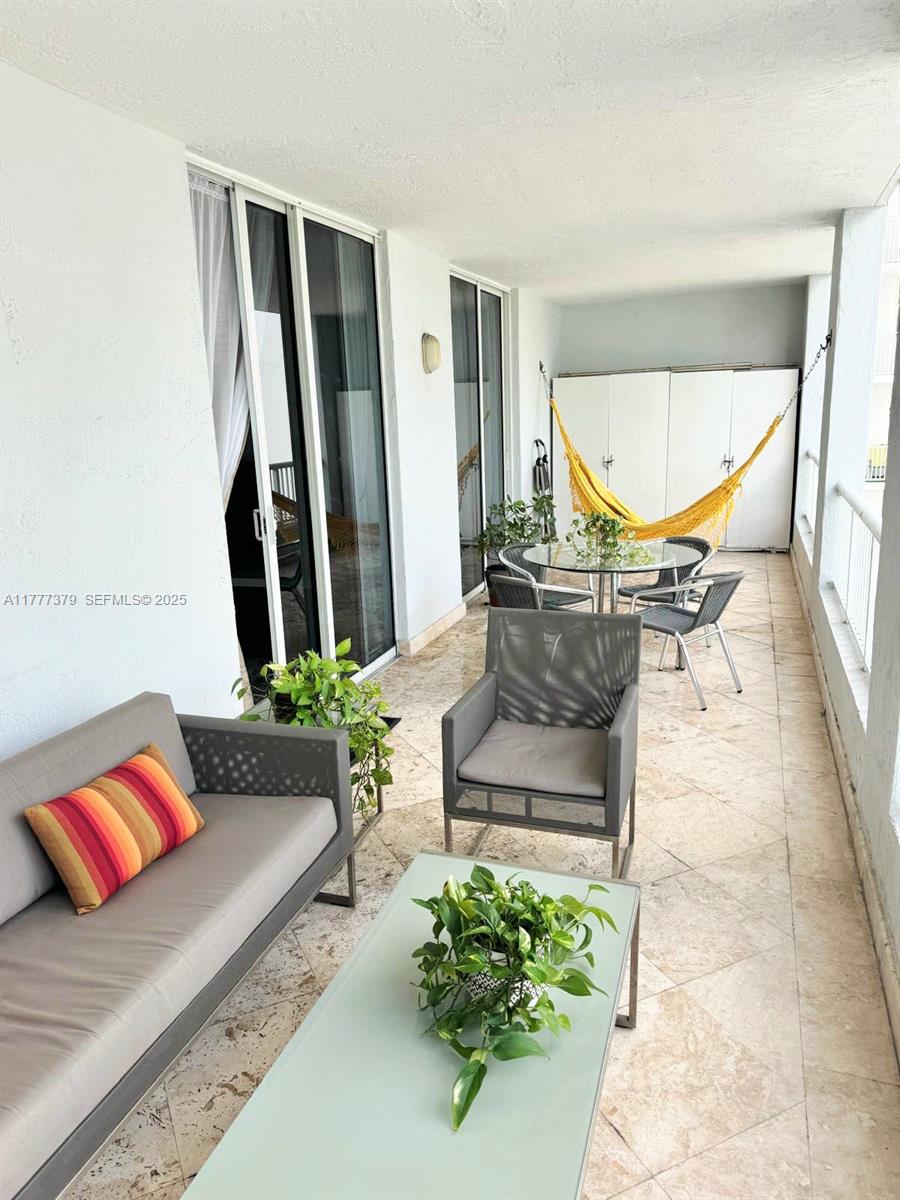 170 Southeast 14th Street, Unit 2705 Miami, FL 33131 - Photo 18 of 41 a living room with furniture and a potted plant