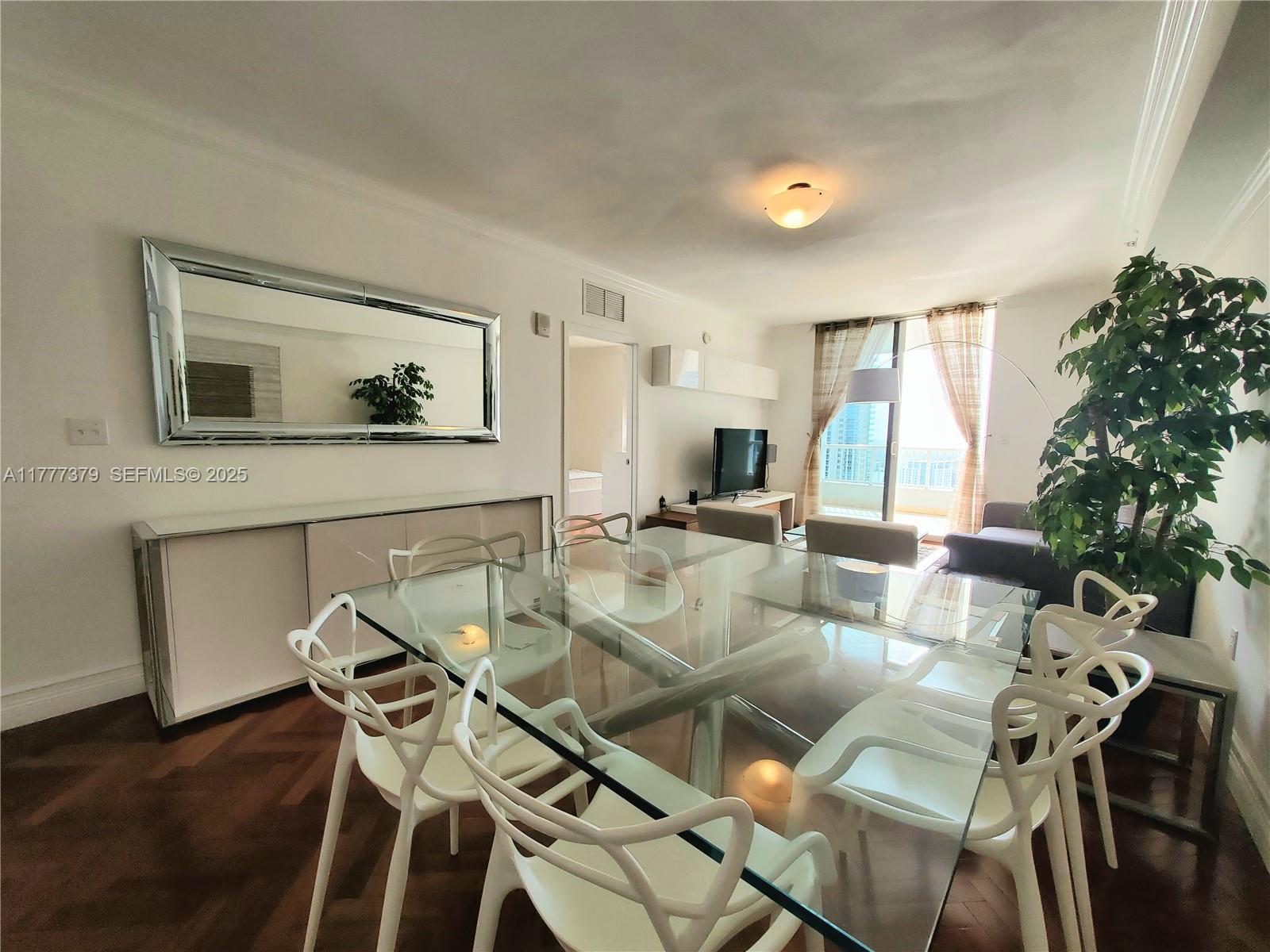 170 Southeast 14th Street, Unit 2705 Miami, FL 33131 - Photo 26 of 41 a living room with furniture and a flat screen tv