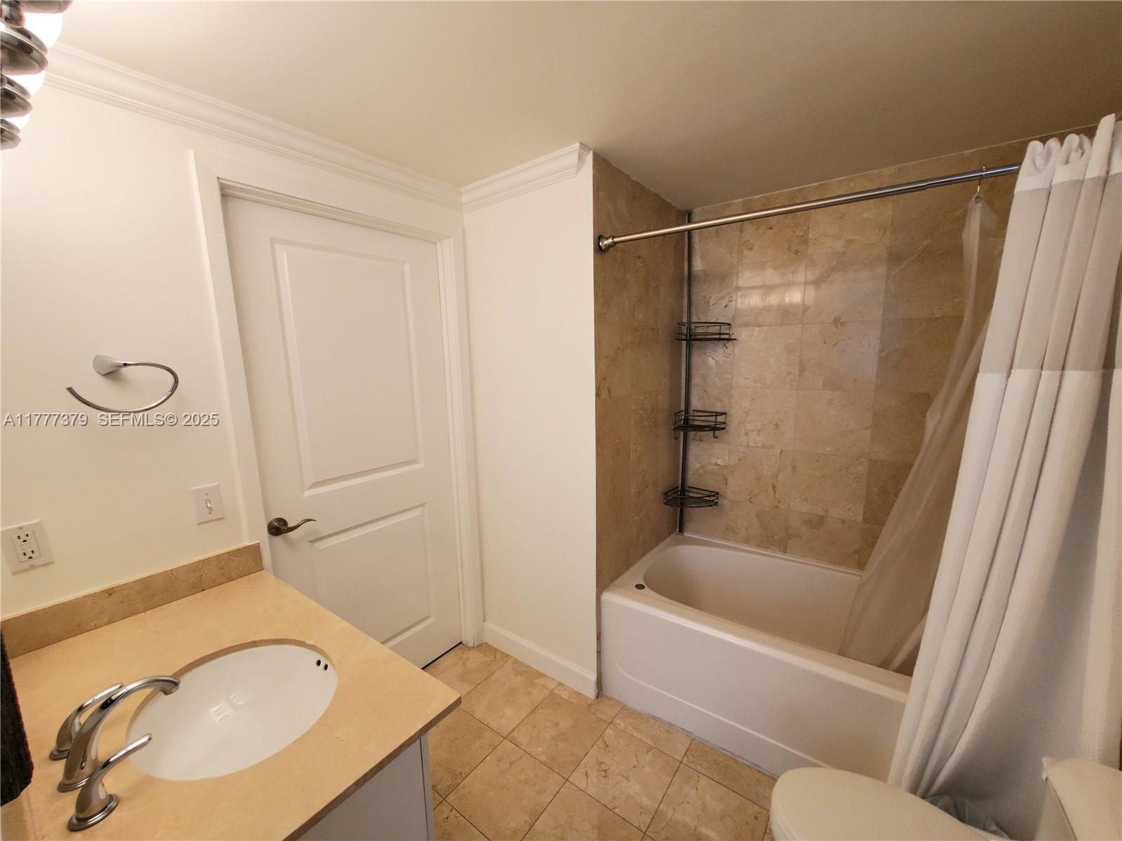 170 Southeast 14th Street, Unit 2705 Miami, FL 33131 - Photo 36 of 41 a bathroom with a sink and a bathtub