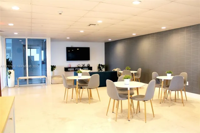 a view of a swimming pool with outdoor seating