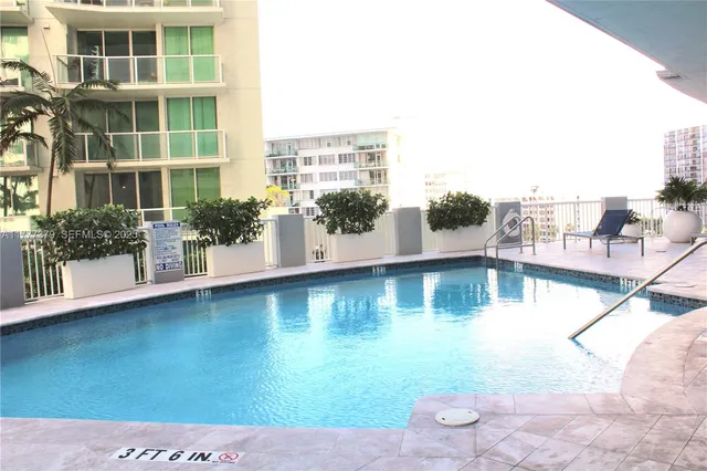 a view of pool with outdoor seating