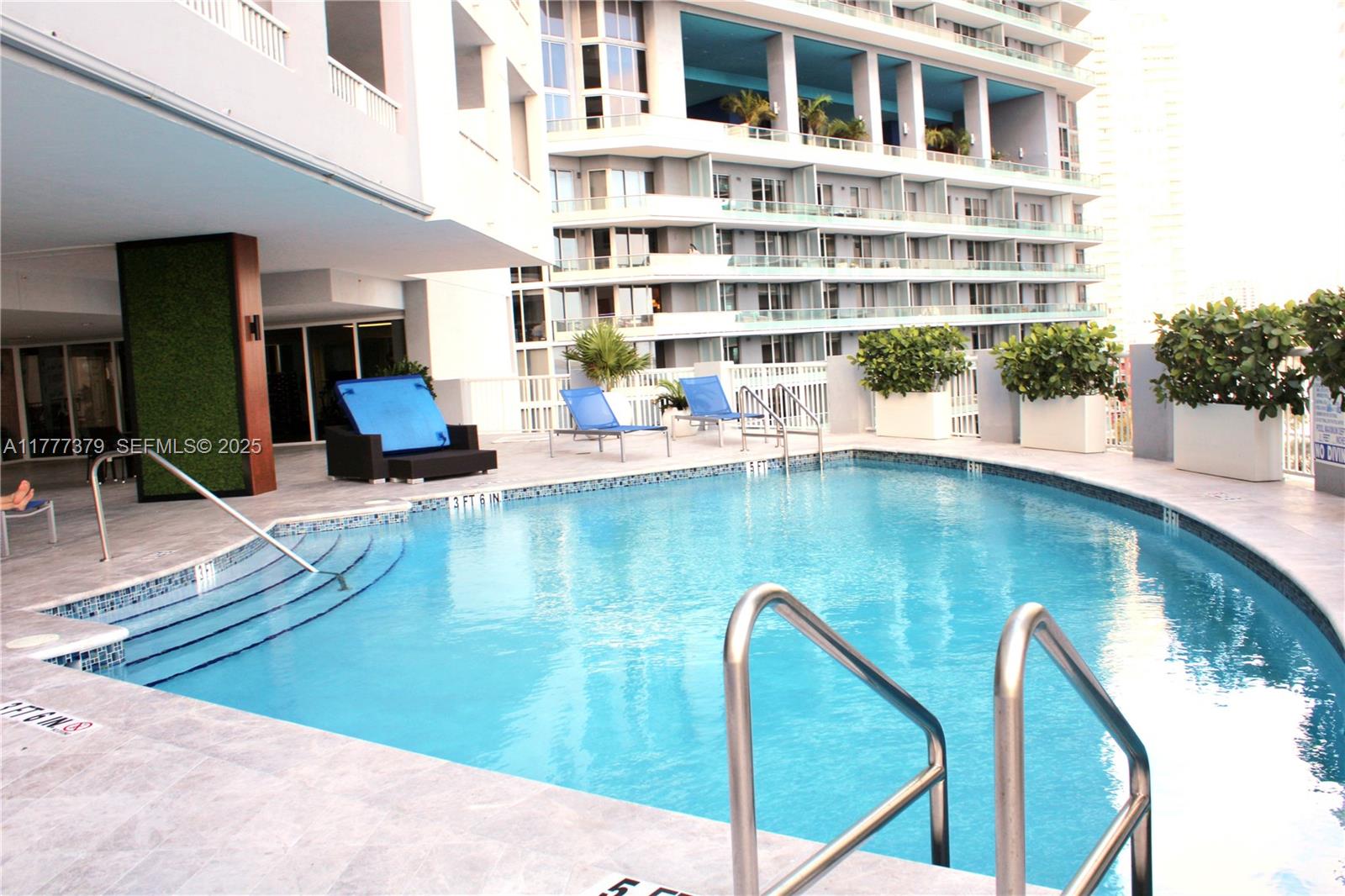 170 Southeast 14th Street, Unit 2705 Miami, FL 33131 - Photo 39 of 41 a view of pool with outdoor seating