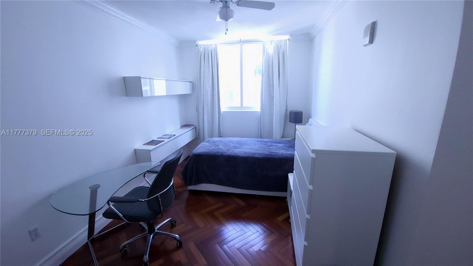 170 Southeast 14th Street, Unit 2705 Miami, FL 33131 - Photo 41 of 41 a bedroom with a bed and a window