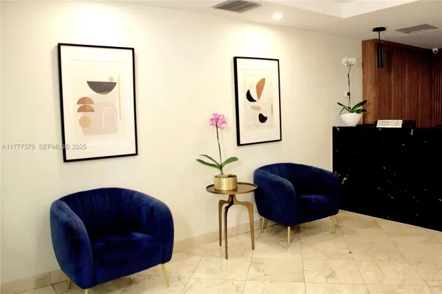 a living room with furniture and a mirror