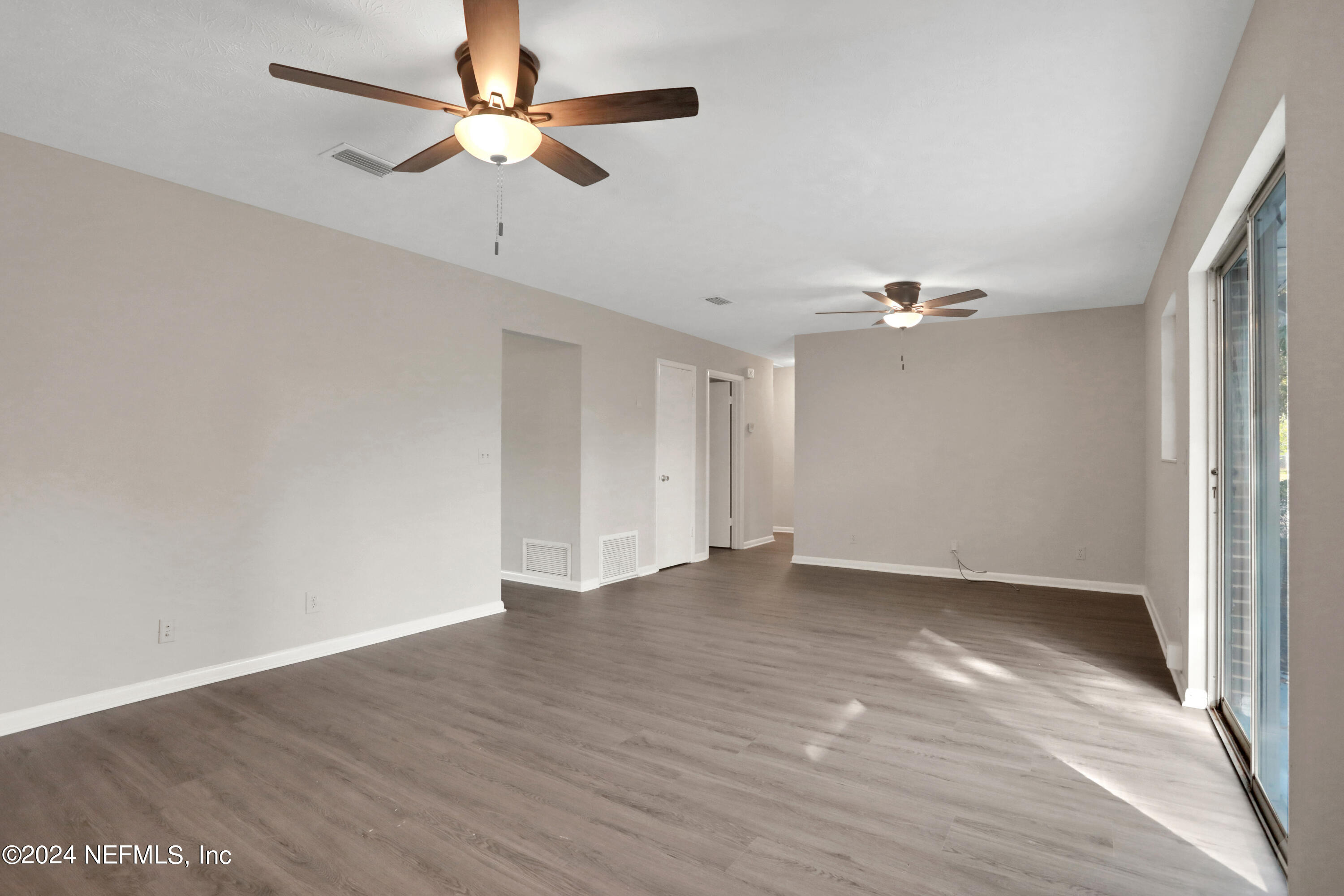 3211 Victoria Park Road Jacksonville, FL 32216 - Photo 11 of 25 a view of an empty room with a window