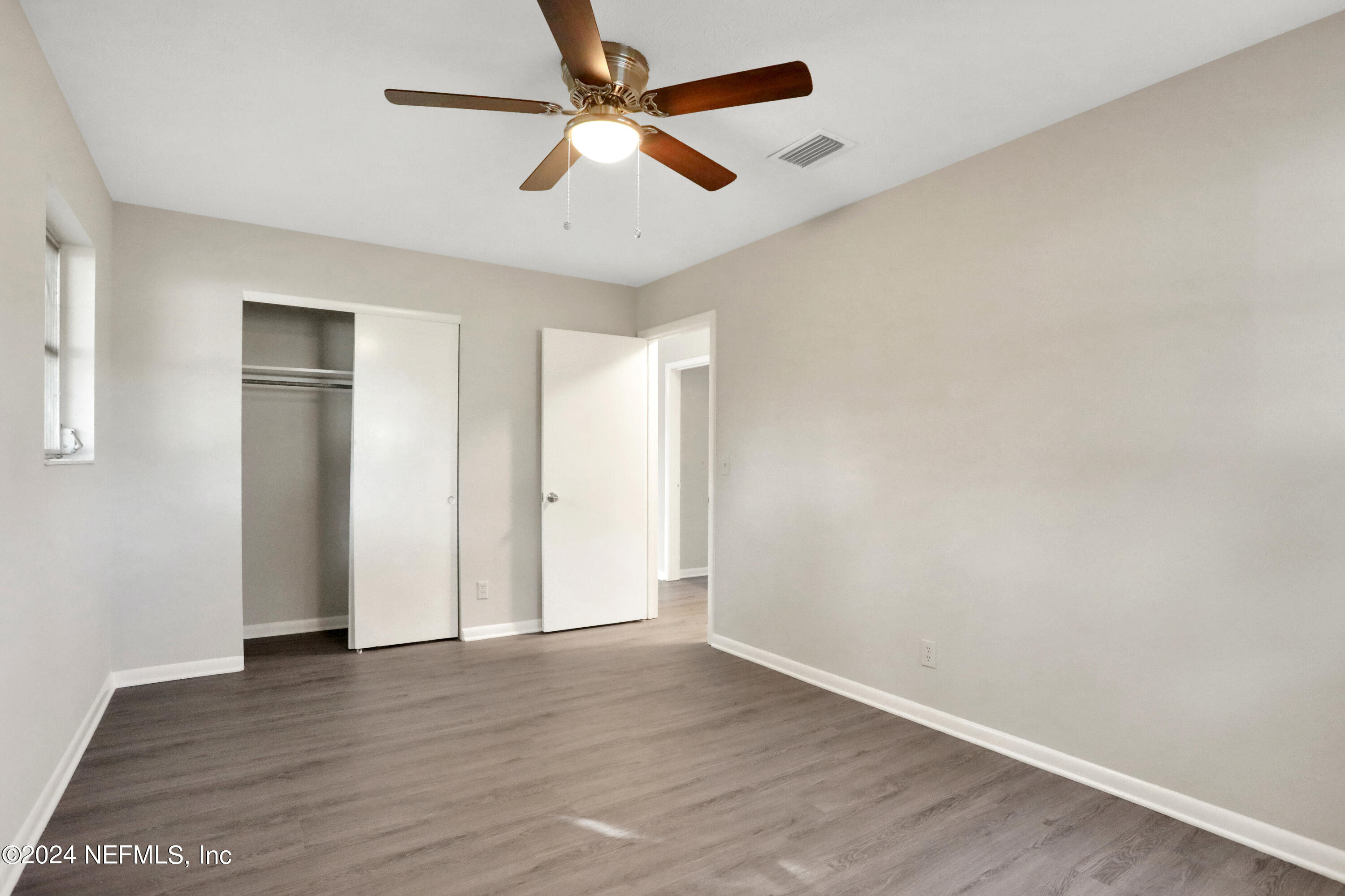 3211 Victoria Park Road Jacksonville, FL 32216 - Photo 19 of 25 wooden floor in an empty room