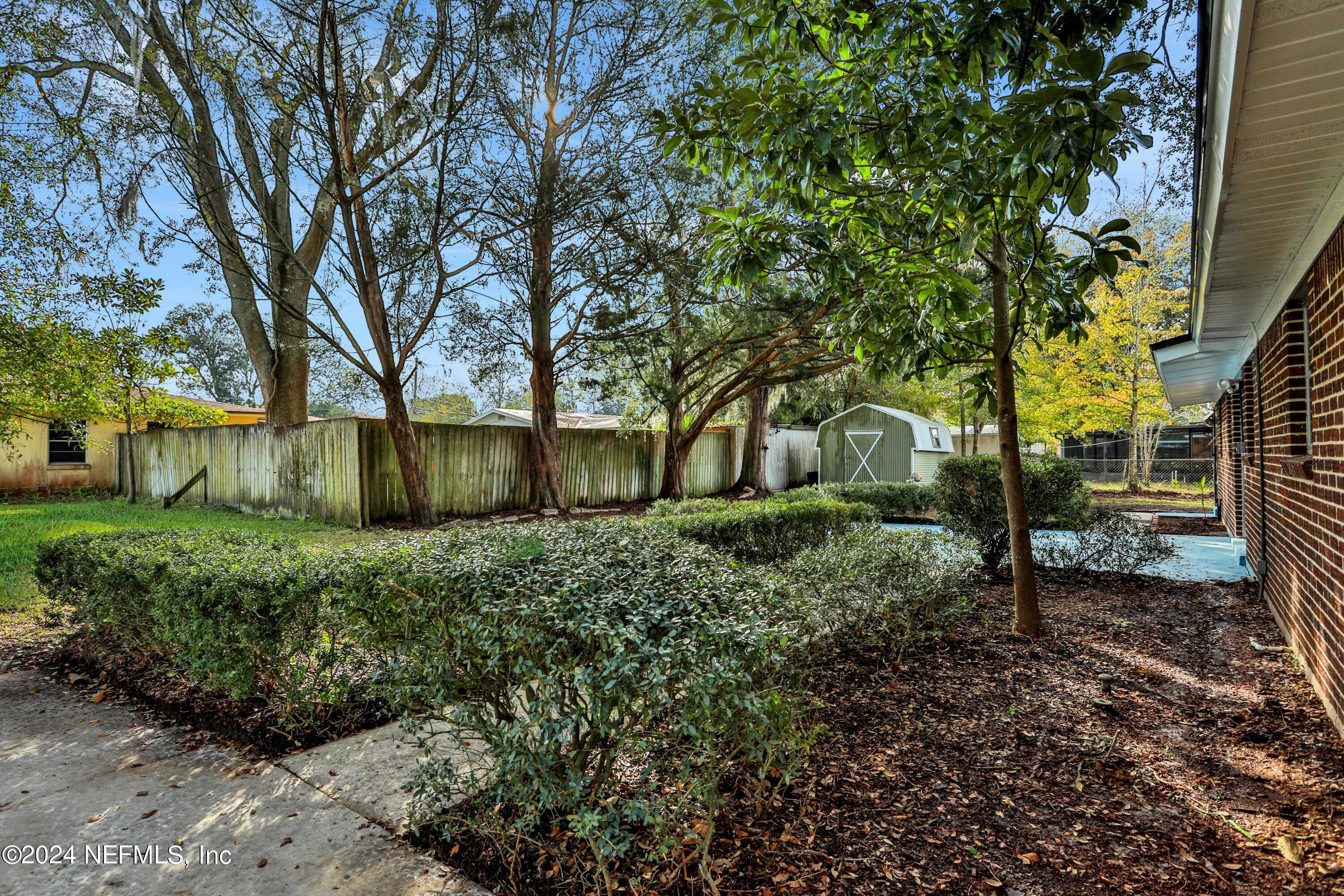 3211 Victoria Park Road Jacksonville, FL 32216 - Photo 23 of 25 a view of backyard with tree
