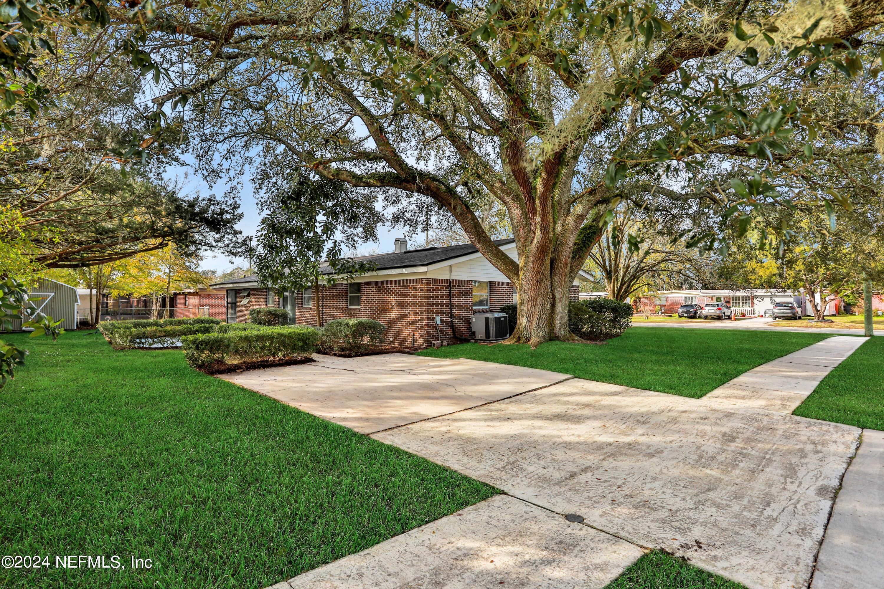 3211 Victoria Park Road Jacksonville, FL 32216 - Photo 25 of 25 a front view of a house with yard and green space