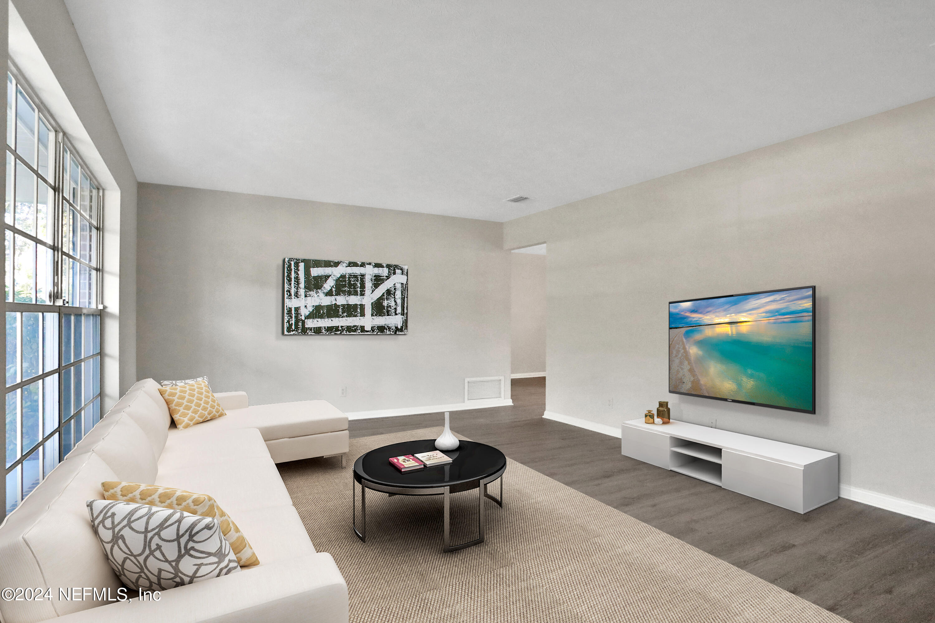 3211 Victoria Park Road Jacksonville, FL 32216 - Photo 5 of 25 a living room with furniture and a flat screen tv