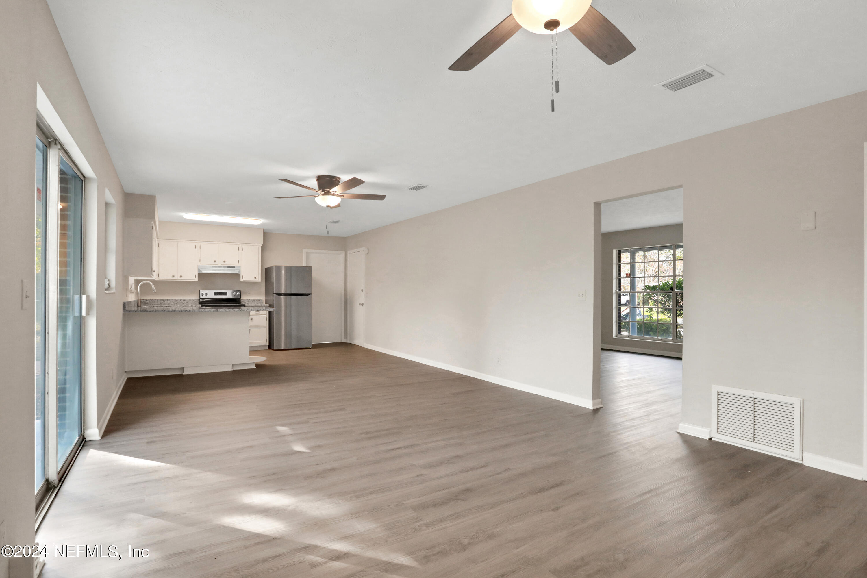 3211 Victoria Park Road Jacksonville, FL 32216 - Photo 6 of 25 a view of a kitchen with a sink and dishwasher cabinets