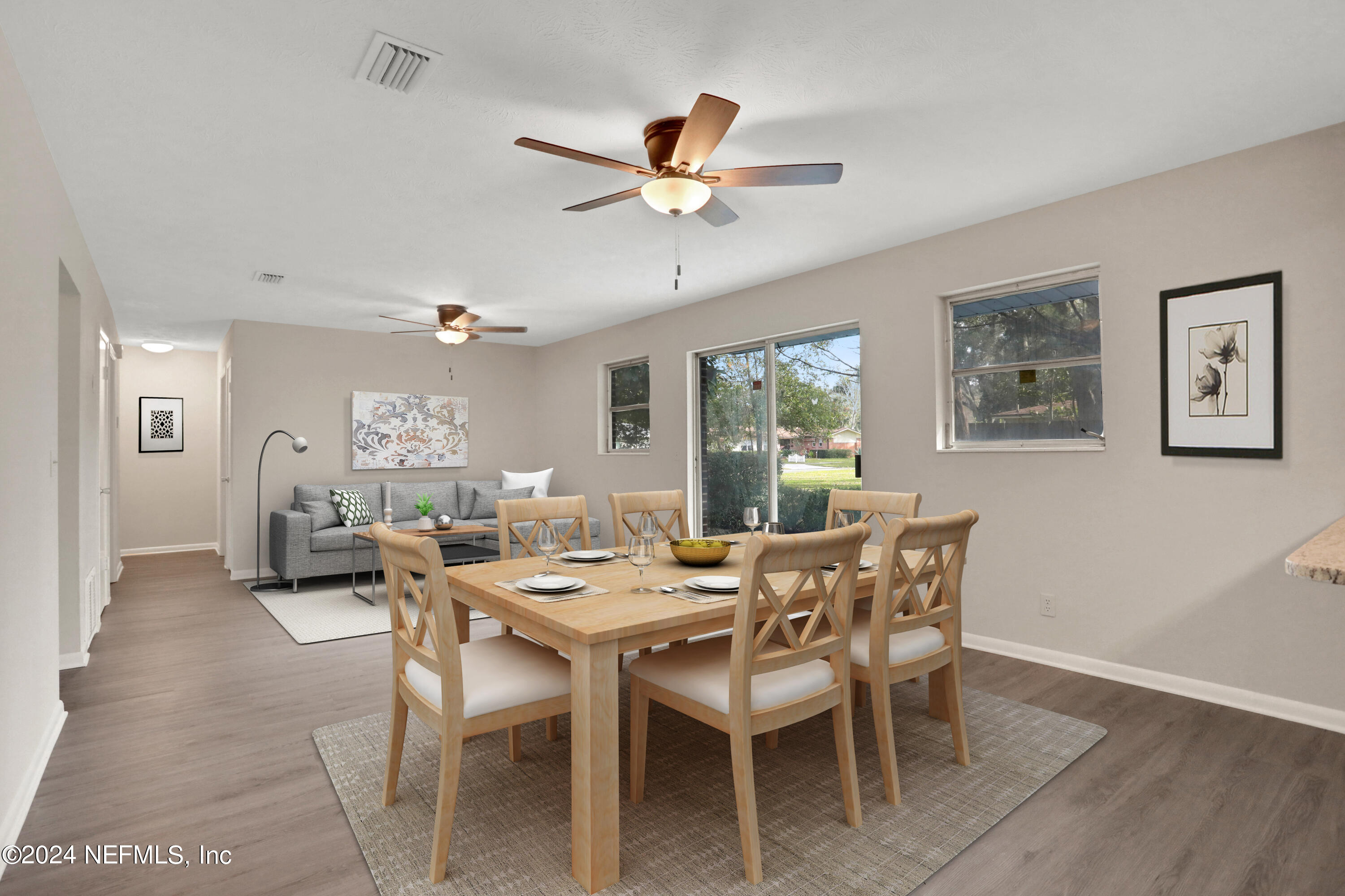 3211 Victoria Park Road Jacksonville, FL 32216 - Photo 10 of 25 a dining room with furniture a window and a chandelier