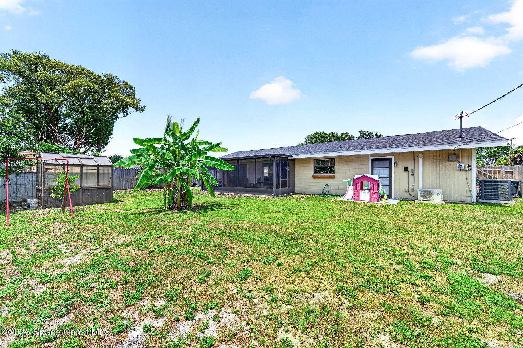 996 Botany Lane Rockledge, FL 32955 - Photo 34 of 35 a front view of a house with garden