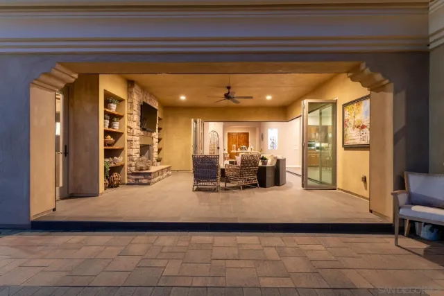 a living room with fireplace furniture and a flat screen tv