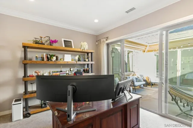 a kitchen with granite countertop cabinets stainless steel appliances a sink and a large window