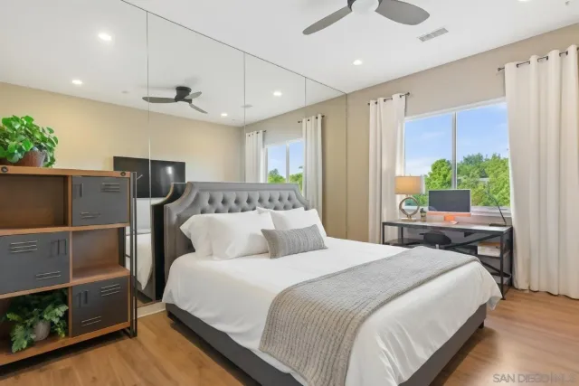 a front view of a house with a yard and green space