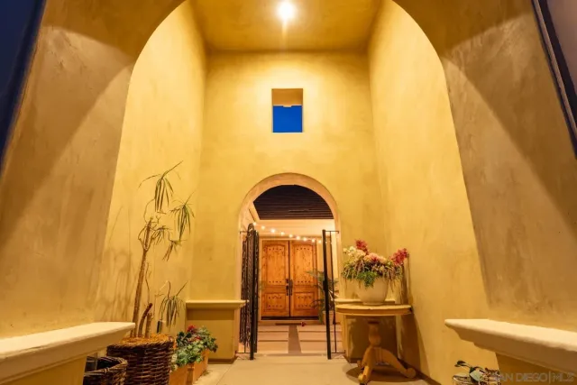 a view of a livingroom with furniture and staircase