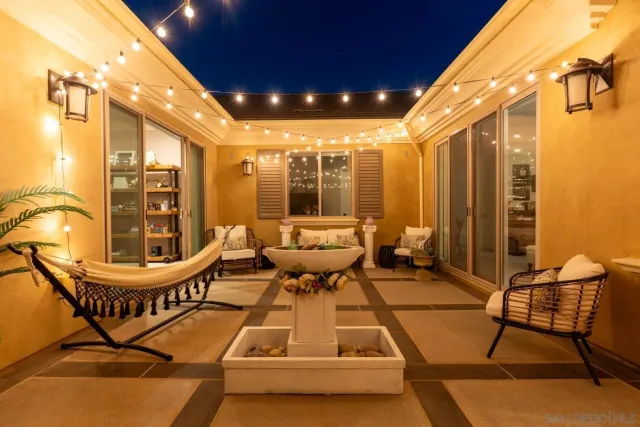 a living room with lots of furniture and a view of dining table