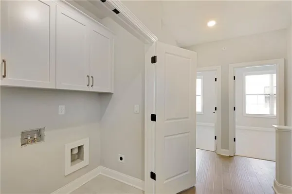 a view of an empty room and wooden floor