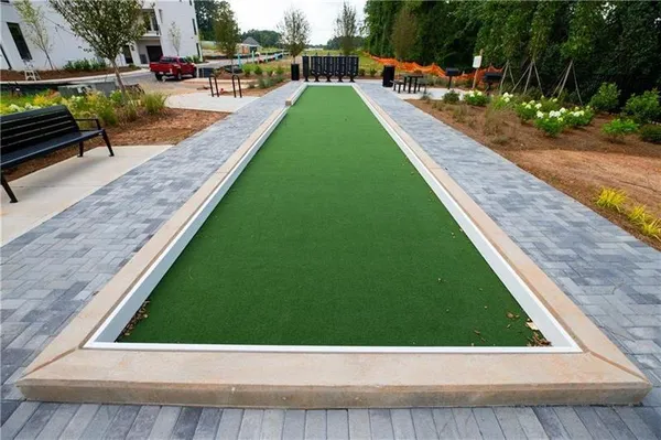 an aerial view of multiple houses with yard