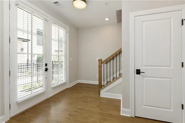 a view of entryway with wooden floor