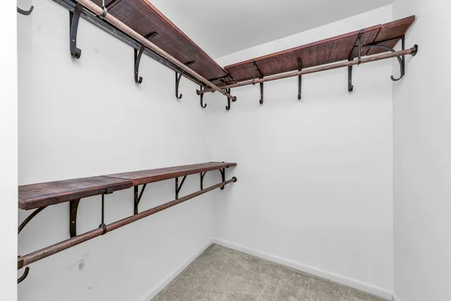 a view of a hallway with stairs