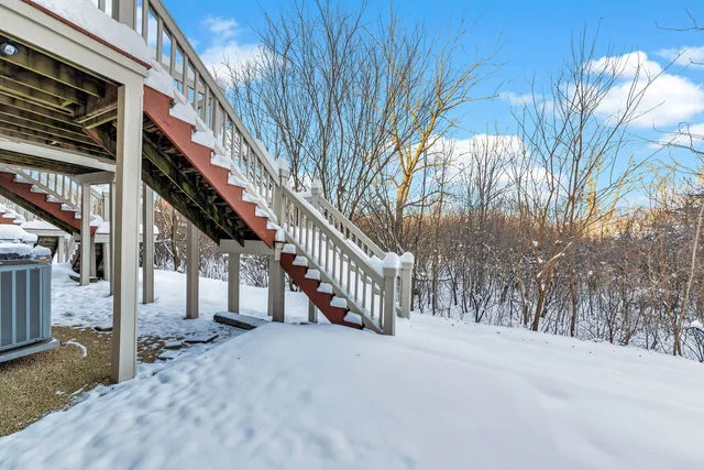 a view of a house with a snow in the yard