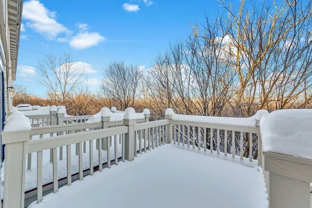 a view of a balcony with wooden fence