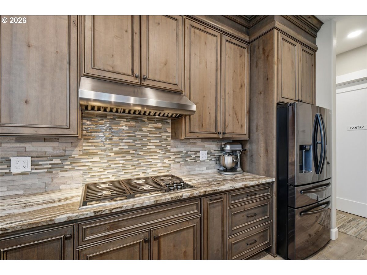 4026 Northwest 75th Avenue, Unit 70 Camas, WA 98607 - Photo 13 of 47 a kitchen with granite countertop stainless steel appliances and refrigerator